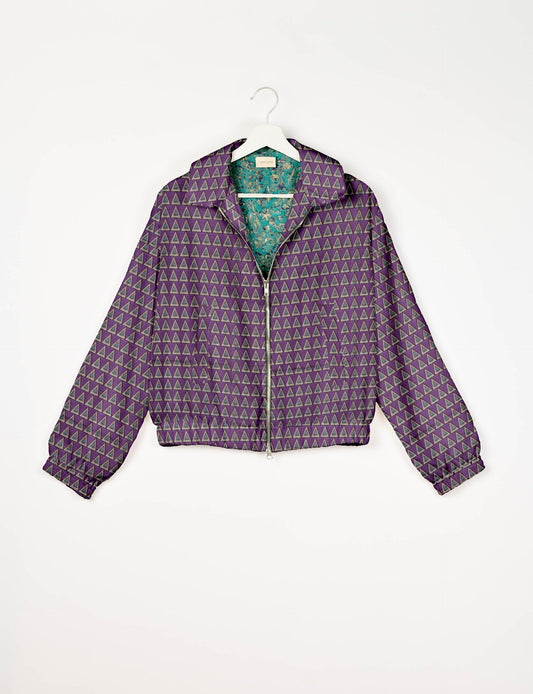 Upcycled Bomber Jacket made from recycled sari materials, featuring a cute cropped shape, elasticated hem and cuffs, and contrast sari print lining. Sustainable apparel promoting eco-friendly fashion and ethical clothing.