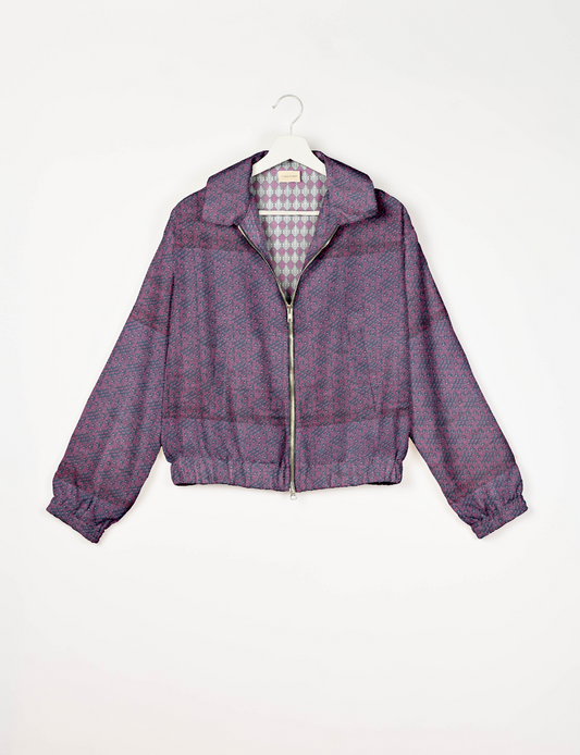 Upcycled Bomber Jacket made from recycled sari materials, featuring a cute cropped shape, elasticated hem and cuffs, and contrast sari print lining. Sustainable apparel promoting eco-friendly fashion and ethical clothing.