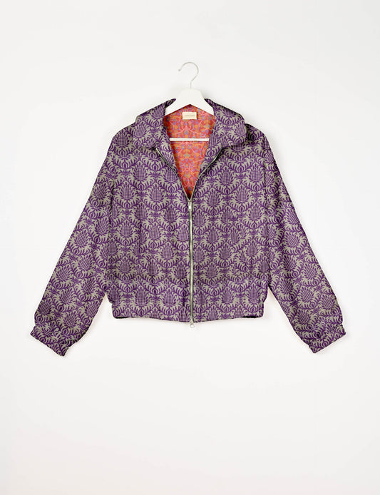 Upcycled Bomber Jacket made from recycled sari materials, featuring a cute cropped shape, elasticated hem and cuffs, and contrast sari print lining. Sustainable apparel promoting eco-friendly fashion and ethical clothing.