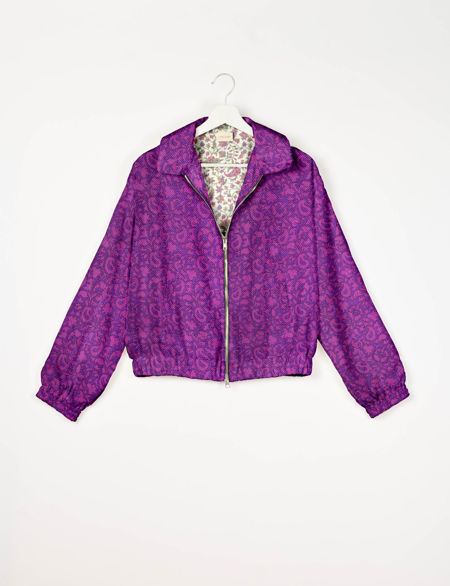 Upcycled Bomber Jacket made from recycled sari materials, featuring a cute cropped shape, elasticated hem and cuffs, and contrast sari print lining. Sustainable apparel promoting eco-friendly fashion and ethical clothing.