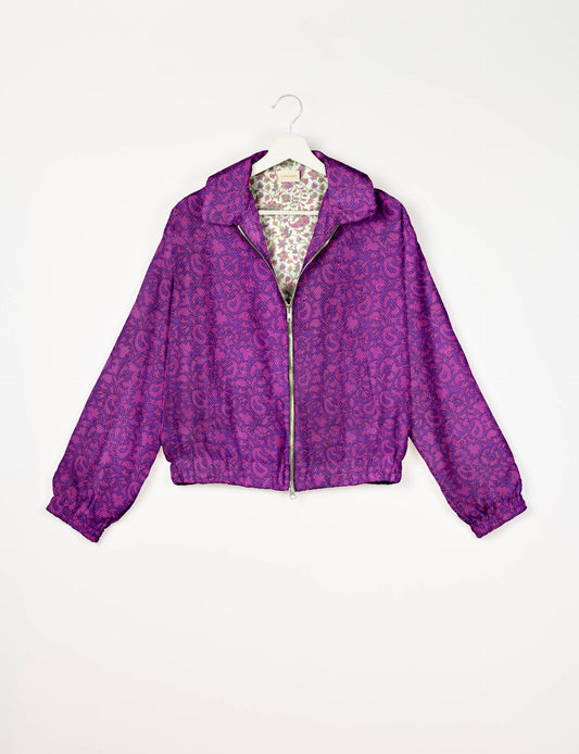 Upcycled Bomber Jacket made from recycled sari materials, featuring a cute cropped shape, elasticated hem and cuffs, and contrast sari print lining. Sustainable apparel promoting eco-friendly fashion and ethical clothing.
