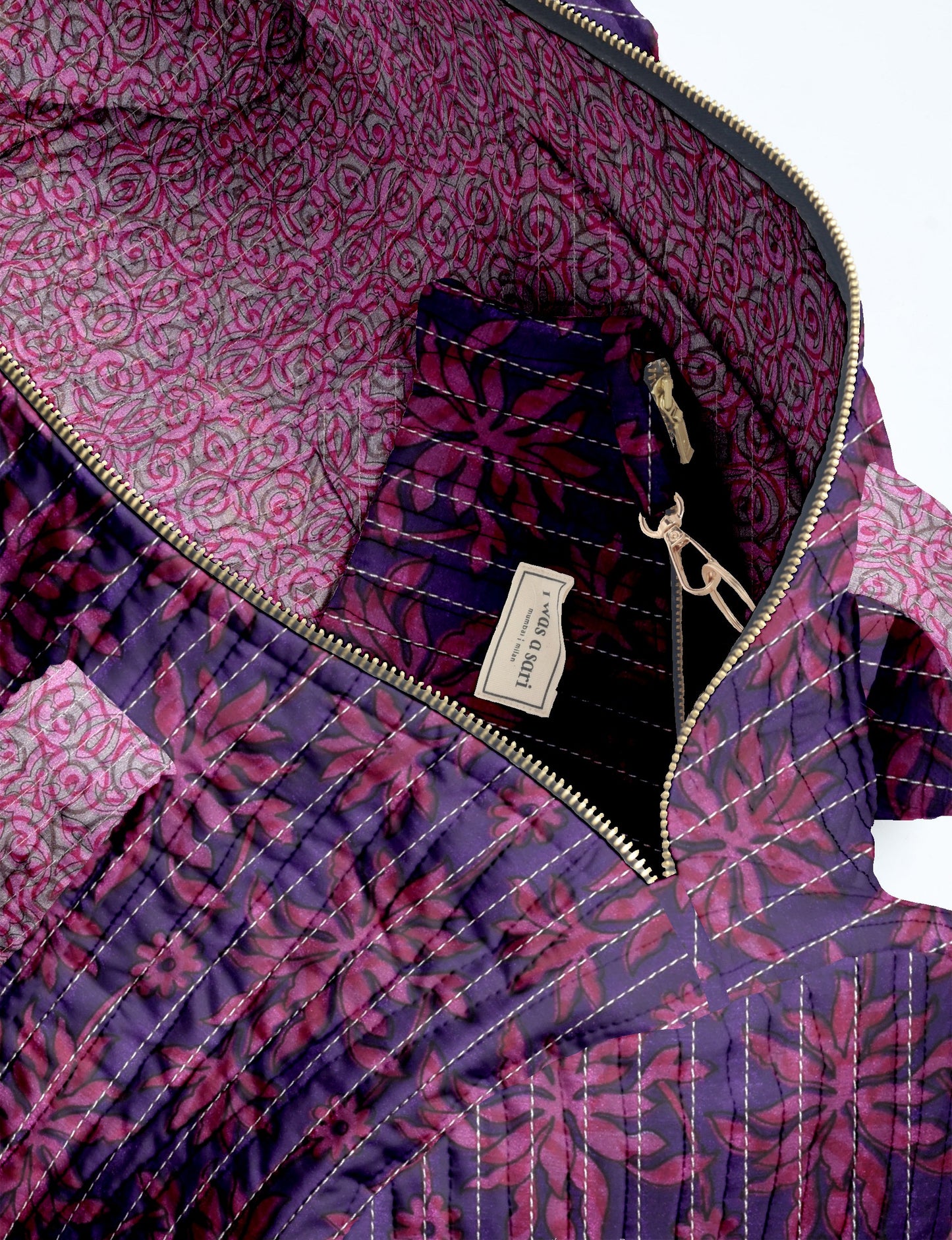 Quilted bowling bag with purple and pink leaf pattern, gold zipper, and interior pocket with label "I WAS A SARI"