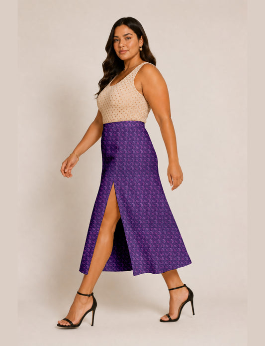 Woman wearing a yellow and black micro patterned A-line skirt with front slit, paired with beige sleeveless top and black