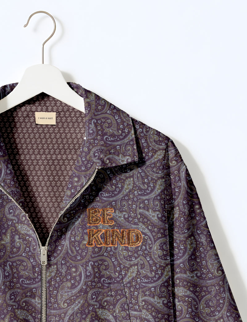 BE KIND Bomber jacket made from upcycled sari fabric with handcrafted Aari embroidery by female artisans.