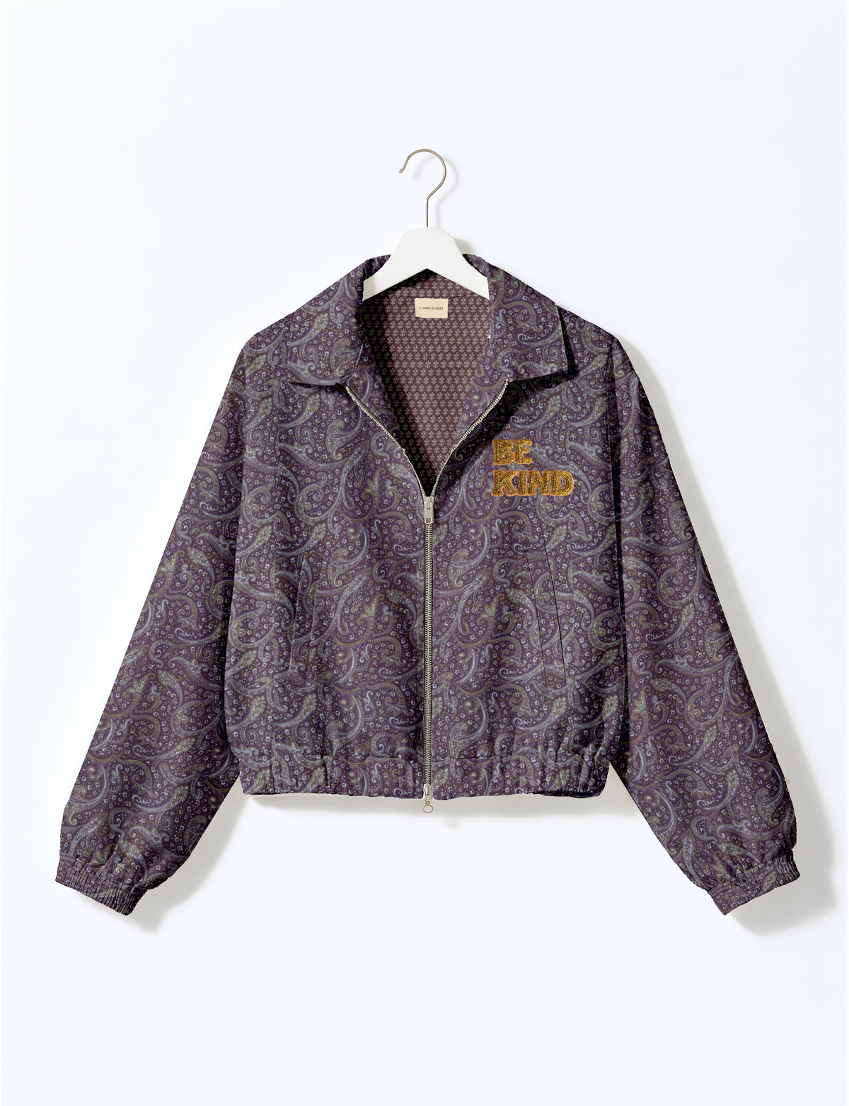 BE KIND Bomber jacket made from upcycled sari fabric with handcrafted Aari embroidery by female artisans.