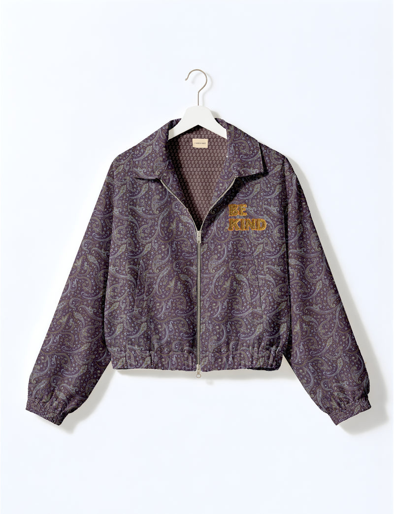 BE KIND Bomber jacket made from upcycled sari fabric with handcrafted Aari embroidery by female artisans.