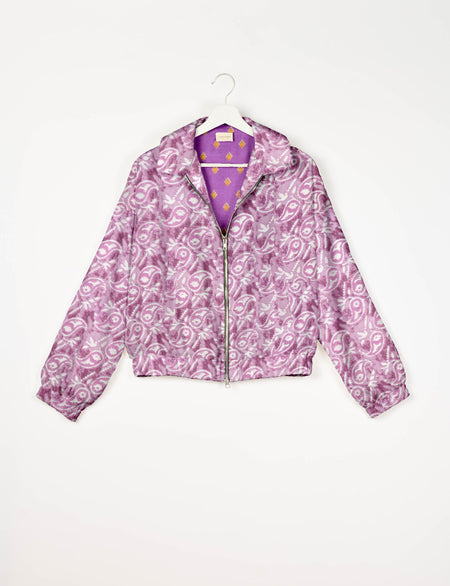 Upcycled Bomber Jacket made from recycled sari materials, featuring a cute cropped shape, elasticated hem and cuffs, and contrast sari print lining. Sustainable apparel promoting eco-friendly fashion and ethical clothing.