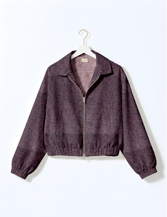 Upcycled Bomber Jacket made from recycled sari materials, featuring a cute cropped shape, elasticated hem and cuffs, and contrast sari print lining. Sustainable apparel promoting eco-friendly fashion and ethical clothing.