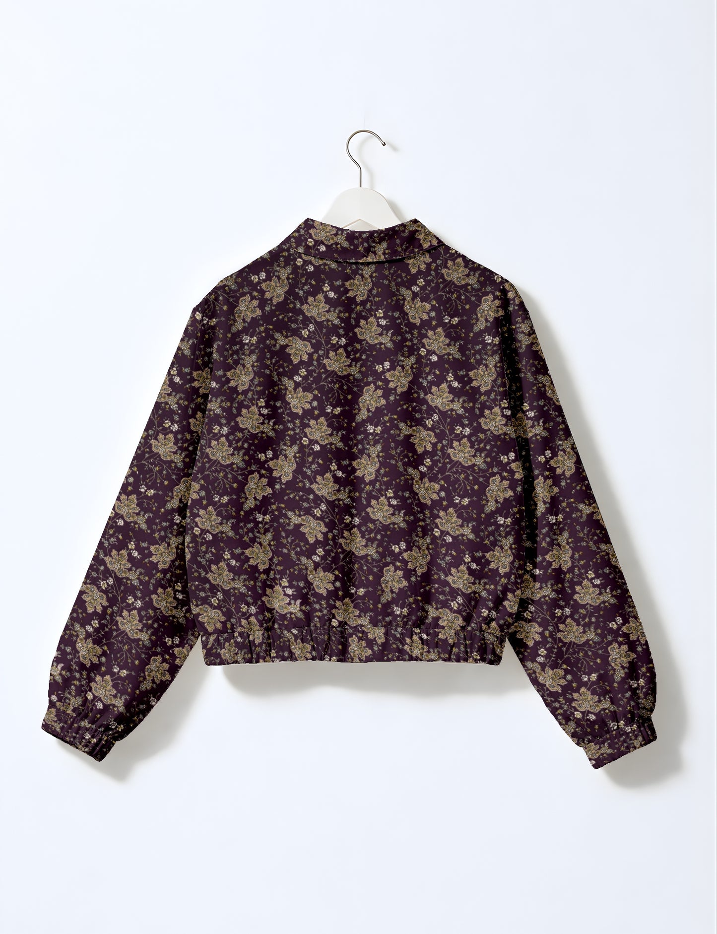 Upcycled Bomber Jacket made from recycled sari materials, featuring a cute cropped shape, elasticated hem and cuffs, and contrast sari print lining. Sustainable apparel promoting eco-friendly fashion and ethical clothing.
