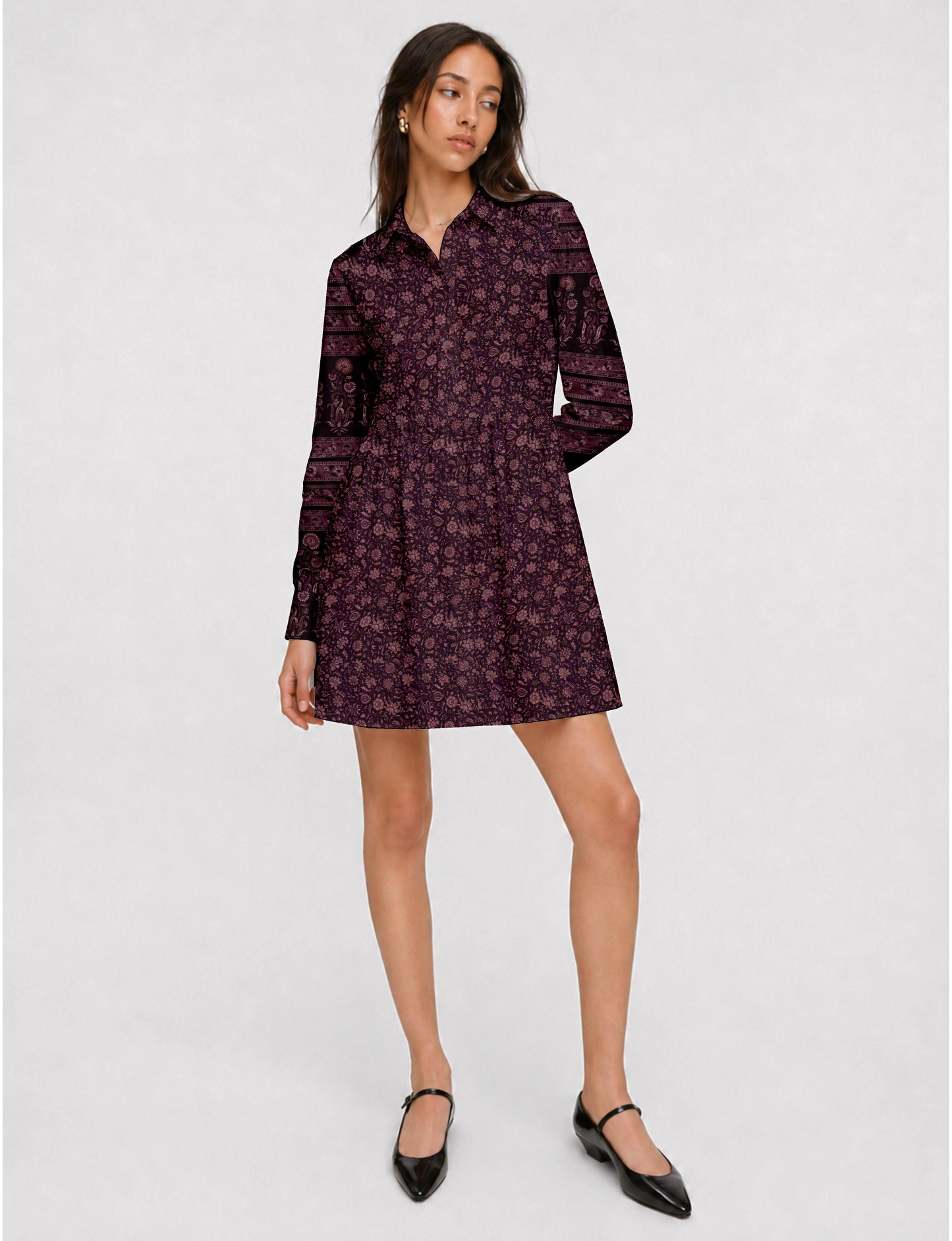 Short shirt dress with a relaxed A-line silhouette, point collar, partial button placket, gathered waist, side pockets, and full-length cuffed sleeves.
