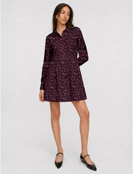 Short shirt dress with a relaxed A-line silhouette, point collar, partial button placket, gathered waist, side pockets, and full-length cuffed sleeves.