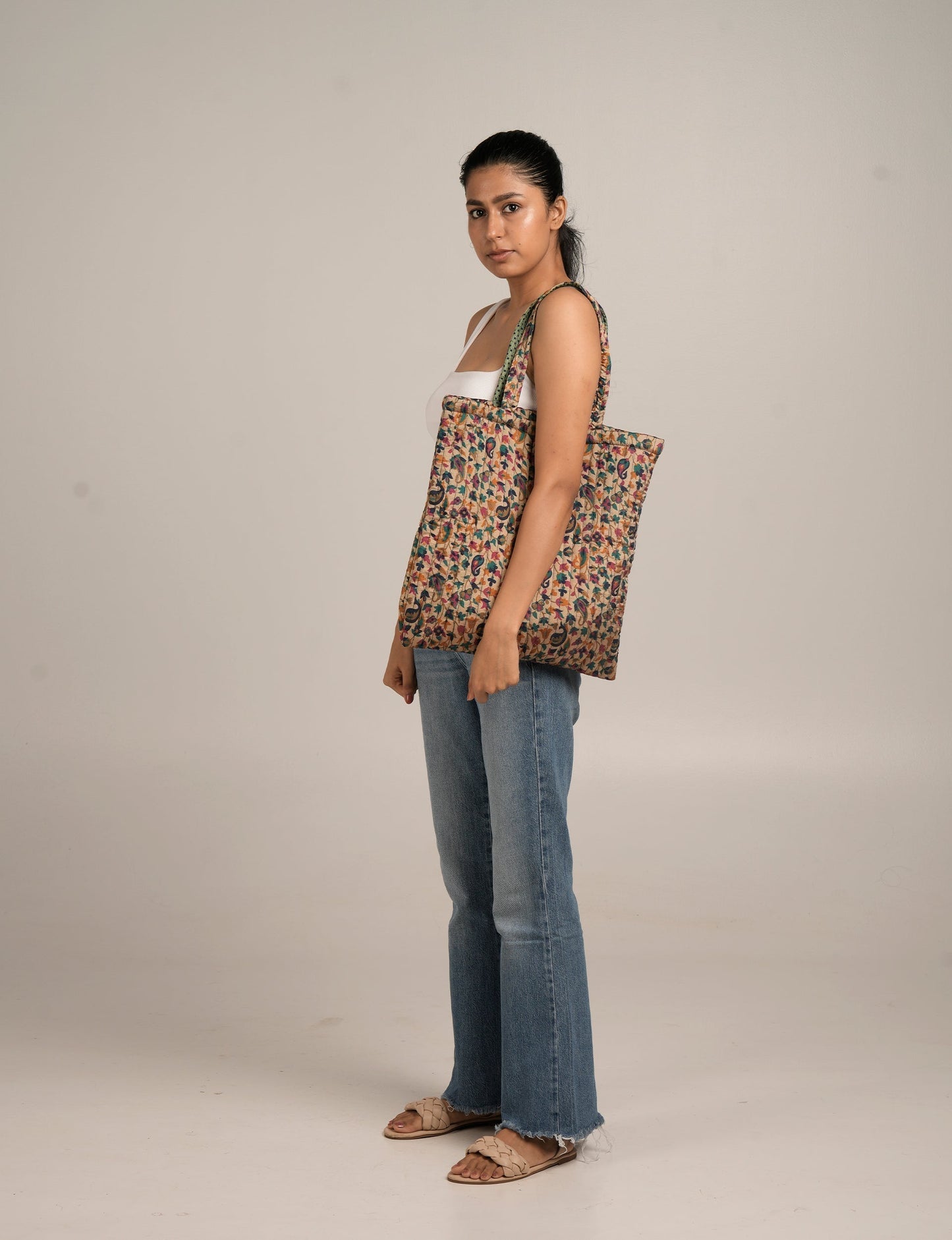 Elevate your style sustainably with our QUILTED SHOPPER BAG. Soft textures, vibrant colors, and a positive impact on people and the planet. Perfect for the office, shopping, or happy hour. Crafted from pre-loved saris for eco-conscious fashionistas!