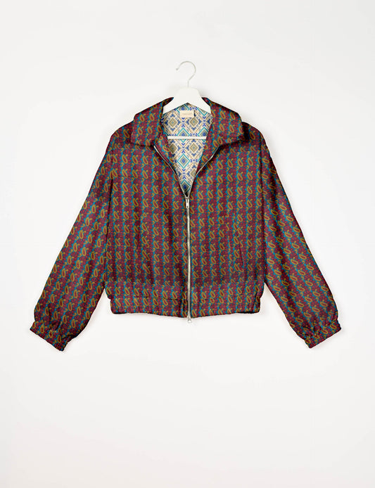 Upcycled Bomber Jacket made from recycled sari materials, featuring a cute cropped shape, elasticated hem and cuffs, and contrast sari print lining. Sustainable apparel promoting eco-friendly fashion and ethical clothing.