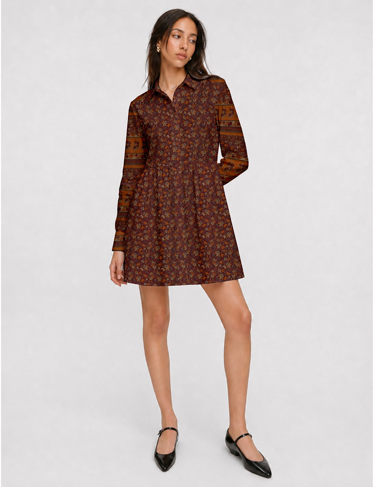 Short shirt dress with a relaxed A-line silhouette, point collar, partial button placket, gathered waist, side pockets, and full-length cuffed sleeves.