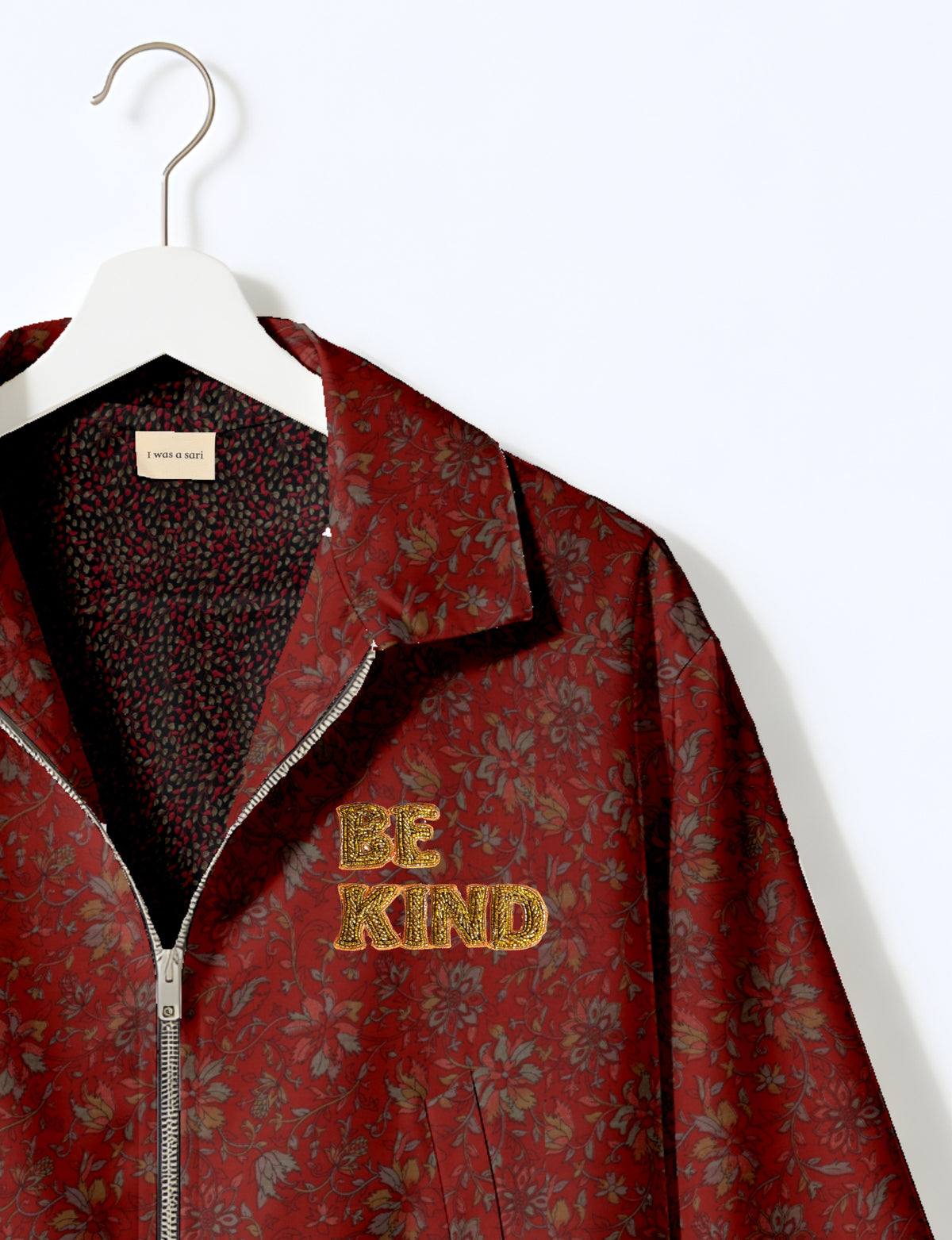 BE KIND Bomber jacket made from upcycled sari fabric with handcrafted Aari embroidery by female artisans.