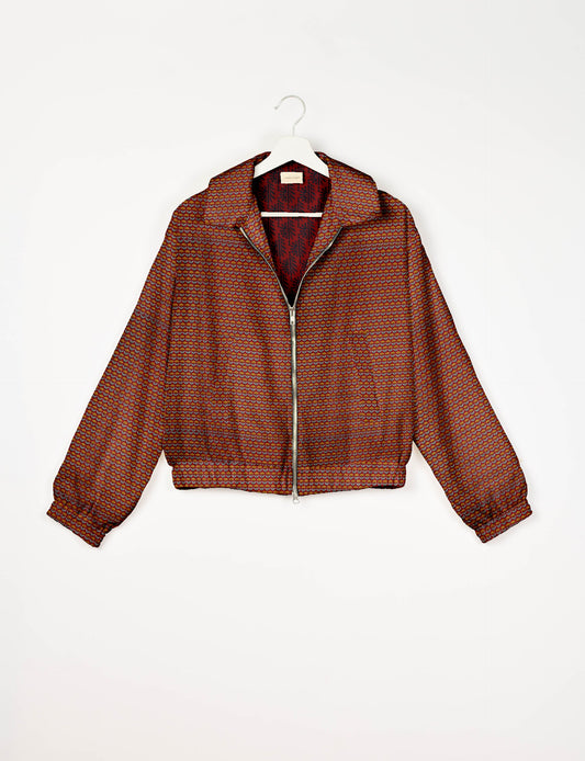Upcycled Bomber Jacket made from recycled sari materials, featuring a cute cropped shape, elasticated hem and cuffs, and contrast sari print lining. Sustainable apparel promoting eco-friendly fashion and ethical clothing.