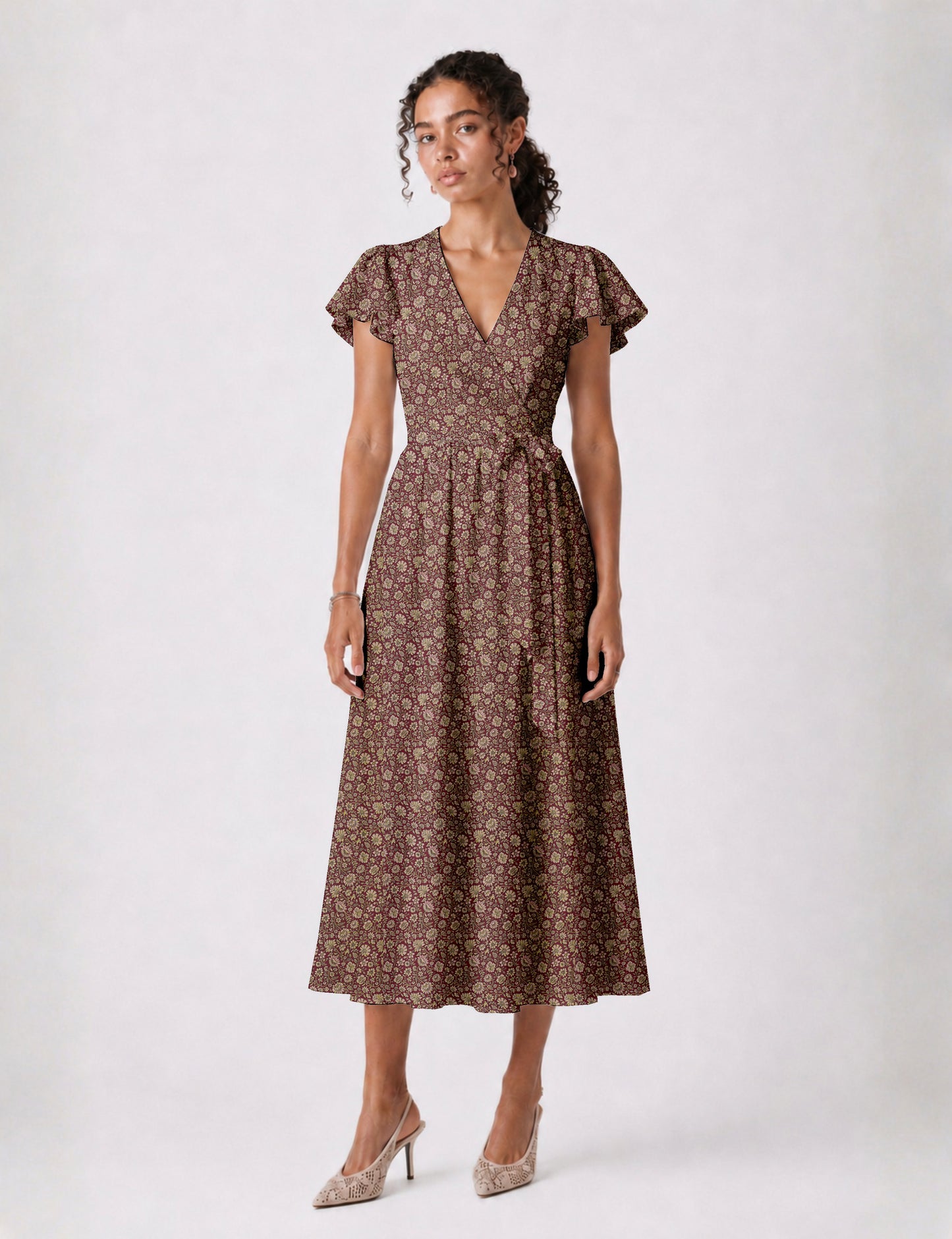 Elegant midi wrap dress with a V-neckline, adjustable waist tie, fitted bodice, and flared skirt for a timeless, flattering silhouette.