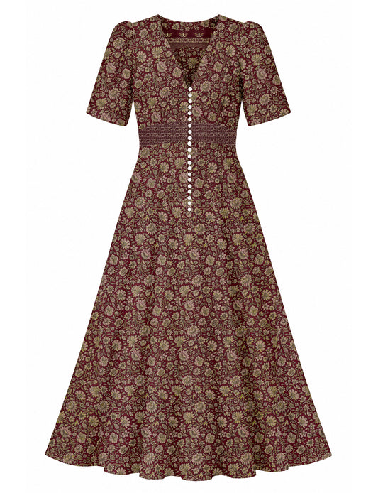 Maxi romantic dress with a fitted bodice, V-neckline, functional button placket, structured waist panel, short sleeves, and a softly flared ankle-length A-line skirt.