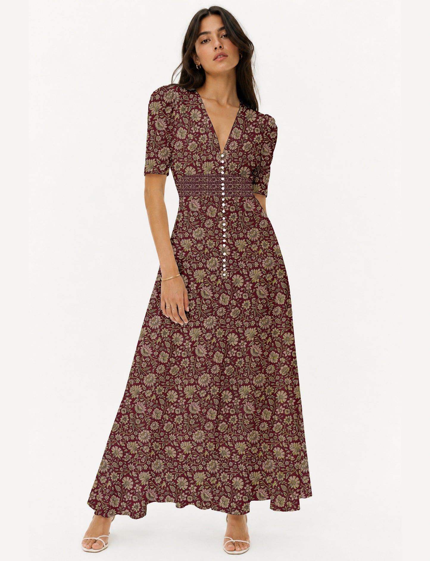 Maxi romantic dress with a fitted bodice, V-neckline, functional button placket, structured waist panel, short sleeves, and a softly flared ankle-length A-line skirt.