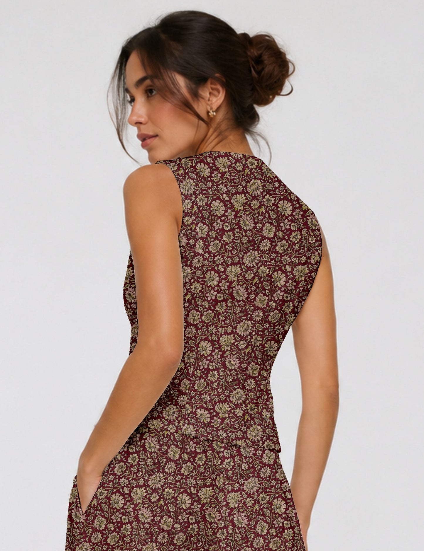 Women's fitted waistcoat with V-neck, single-breasted button closure, tailored silhouette, and pointed hem in sustainable fashion.