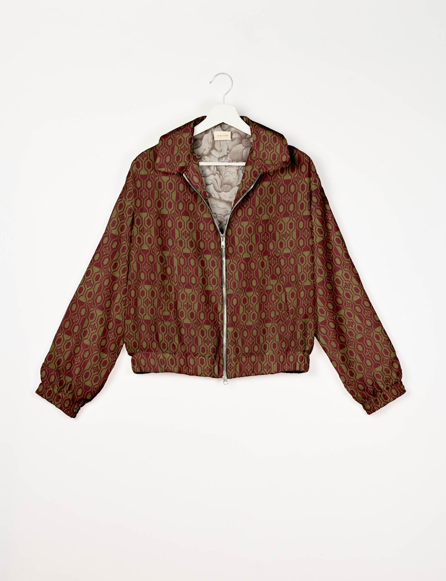 Upcycled Bomber Jacket made from recycled sari materials, featuring a cute cropped shape, elasticated hem and cuffs, and contrast sari print lining. Sustainable apparel promoting eco-friendly fashion and ethical clothing.