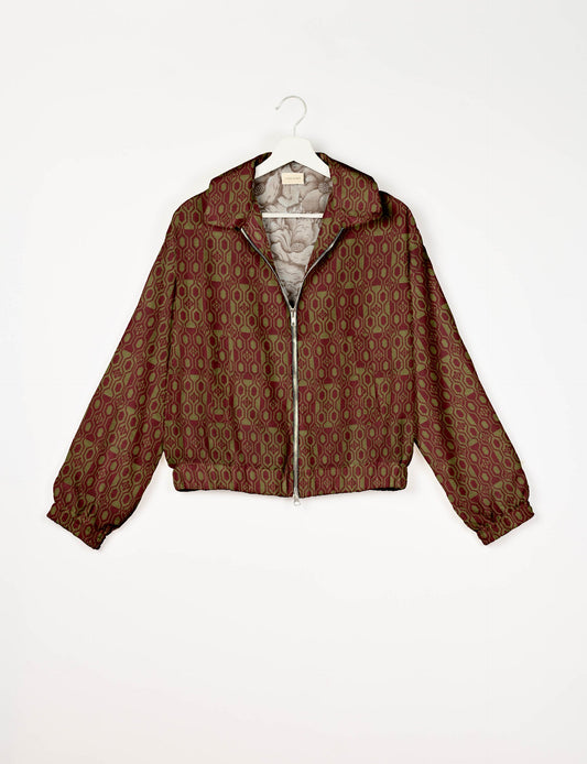 Upcycled Bomber Jacket made from recycled sari materials, featuring a cute cropped shape, elasticated hem and cuffs, and contrast sari print lining. Sustainable apparel promoting eco-friendly fashion and ethical clothing.