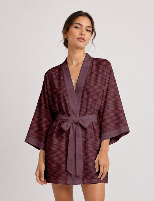 Short kimono robe with wrap front, V-neckline, wide sleeves, waist tie, and concealed skort detail.
