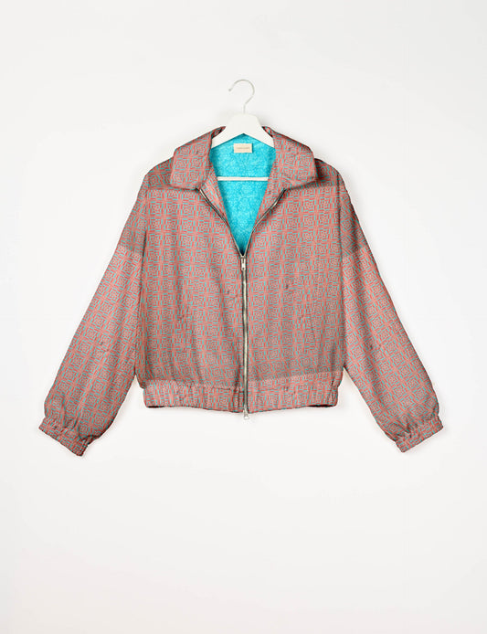 Upcycled Bomber Jacket made from recycled sari materials, featuring a cute cropped shape, elasticated hem and cuffs, and contrast sari print lining. Sustainable apparel promoting eco-friendly fashion and ethical clothing.