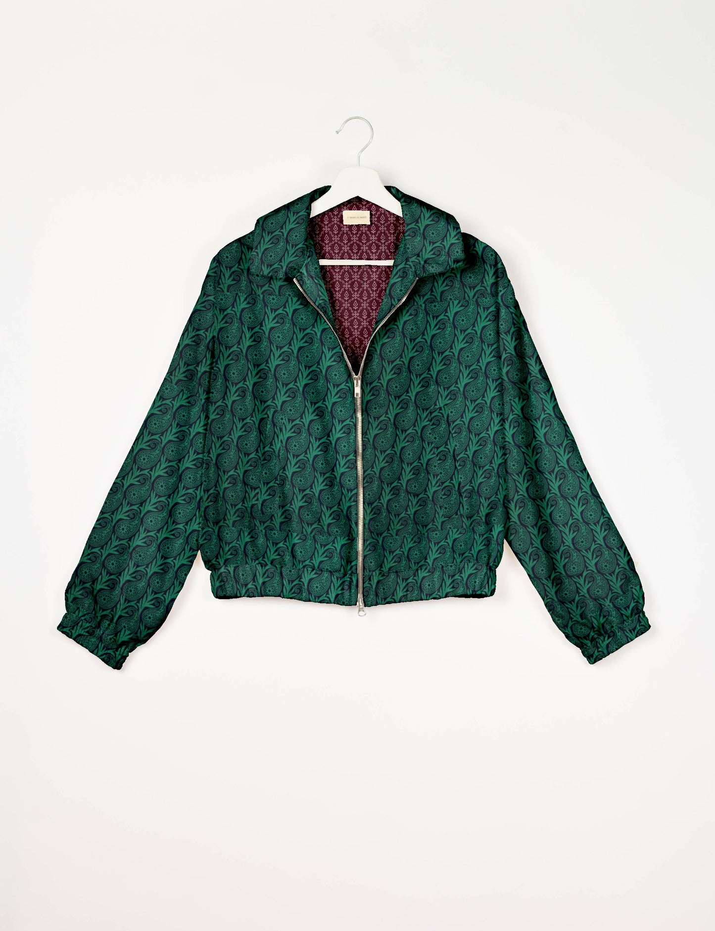 Upcycled Bomber Jacket made from recycled sari materials, featuring a cute cropped shape, elasticated hem and cuffs, and contrast sari print lining. Sustainable apparel promoting eco-friendly fashion and ethical clothing.