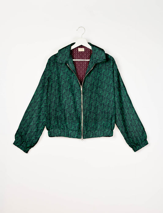 Upcycled Bomber Jacket made from recycled sari materials, featuring a cute cropped shape, elasticated hem and cuffs, and contrast sari print lining. Sustainable apparel promoting eco-friendly fashion and ethical clothing.