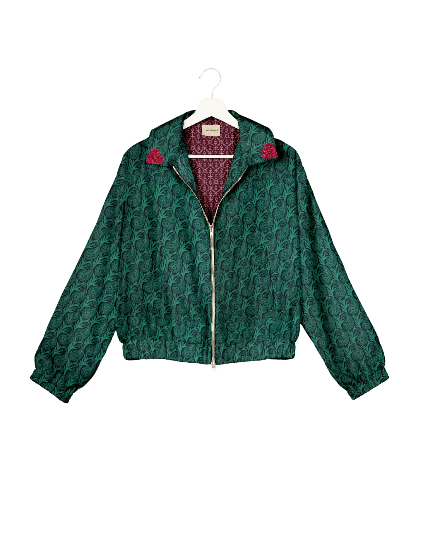 Make a bold statement with our Heart Drop Earrings, a symbol of conscious luxury and ethical fashion. Handcrafted using the intricate Aari embroidery technique, these earrings are made from upcycled sari fabric, embracing slow fashion and zero waste clothing. Elevate your look with sustainable apparel that supports fair trade fashion while reducing textile waste. Choose eco-friendly fashion that speaks of love, artistry, and responsibility.