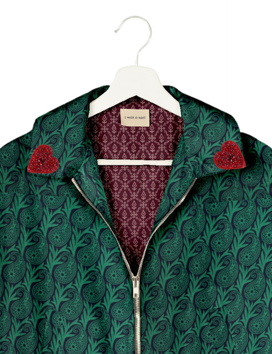 Make a bold statement with our Heart Drop Earrings, a symbol of conscious luxury and ethical fashion. Handcrafted using the intricate Aari embroidery technique, these earrings are made from upcycled sari fabric, embracing slow fashion and zero waste clothing. Elevate your look with sustainable apparel that supports fair trade fashion while reducing textile waste. Choose eco-friendly fashion that speaks of love, artistry, and responsibility.