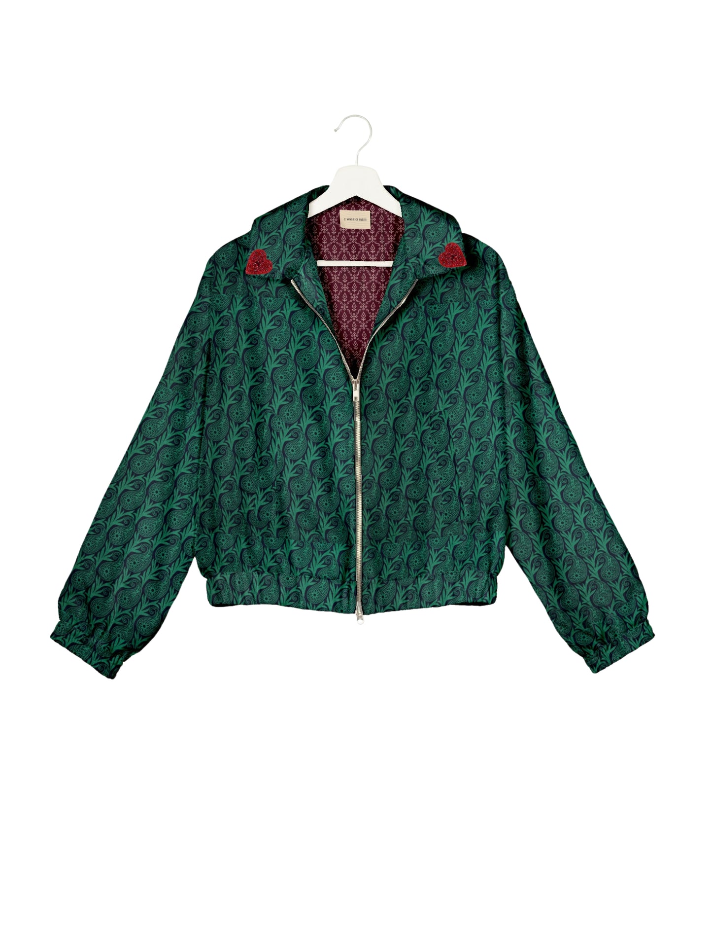 Make a bold statement with our Heart Drop Earrings, a symbol of conscious luxury and ethical fashion. Handcrafted using the intricate Aari embroidery technique, these earrings are made from upcycled sari fabric, embracing slow fashion and zero waste clothing. Elevate your look with sustainable apparel that supports fair trade fashion while reducing textile waste. Choose eco-friendly fashion that speaks of love, artistry, and responsibility.