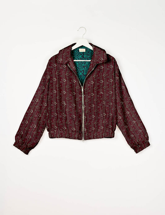 Upcycled Bomber Jacket made from recycled sari materials, featuring a cute cropped shape, elasticated hem and cuffs, and contrast sari print lining. Sustainable apparel promoting eco-friendly fashion and ethical clothing.