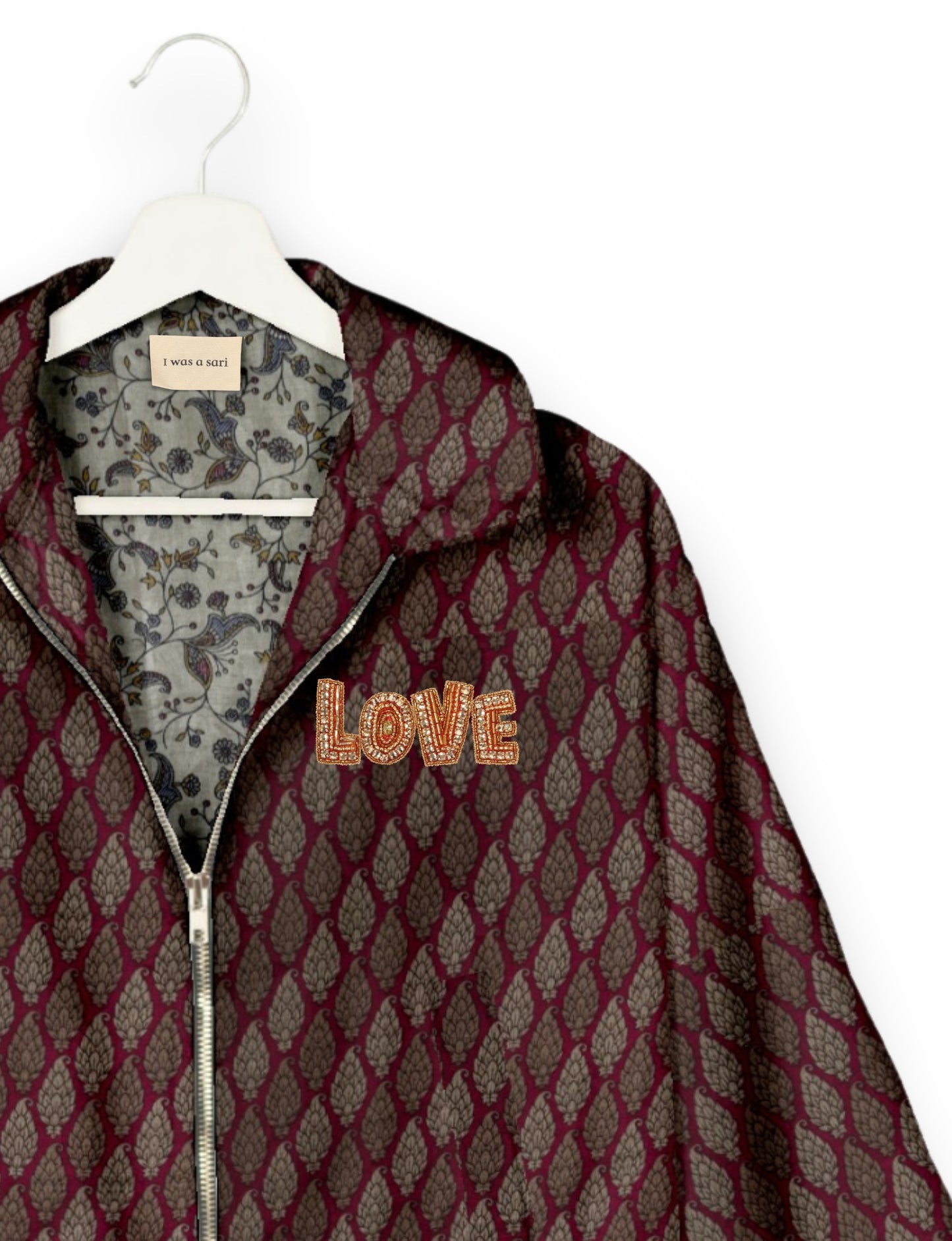 Love Bomber Jacket made from recycled fabric, featuring hand-stitched Aari embroidery. A unique piece of zero-waste clothing, part of the circular fashion movement. Designed with upcycled materials for a stylish yet environmentally friendly clothing choice.