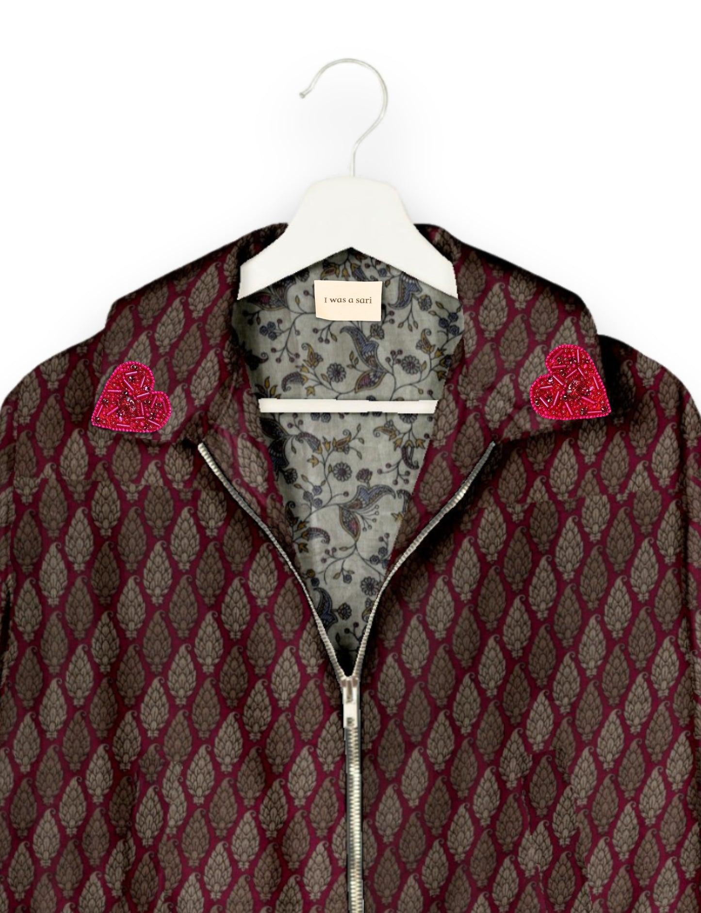 Make a bold statement with our Heart Drop Earrings, a symbol of conscious luxury and ethical fashion. Handcrafted using the intricate Aari embroidery technique, these earrings are made from upcycled sari fabric, embracing slow fashion and zero waste clothing. Elevate your look with sustainable apparel that supports fair trade fashion while reducing textile waste. Choose eco-friendly fashion that speaks of love, artistry, and responsibility.