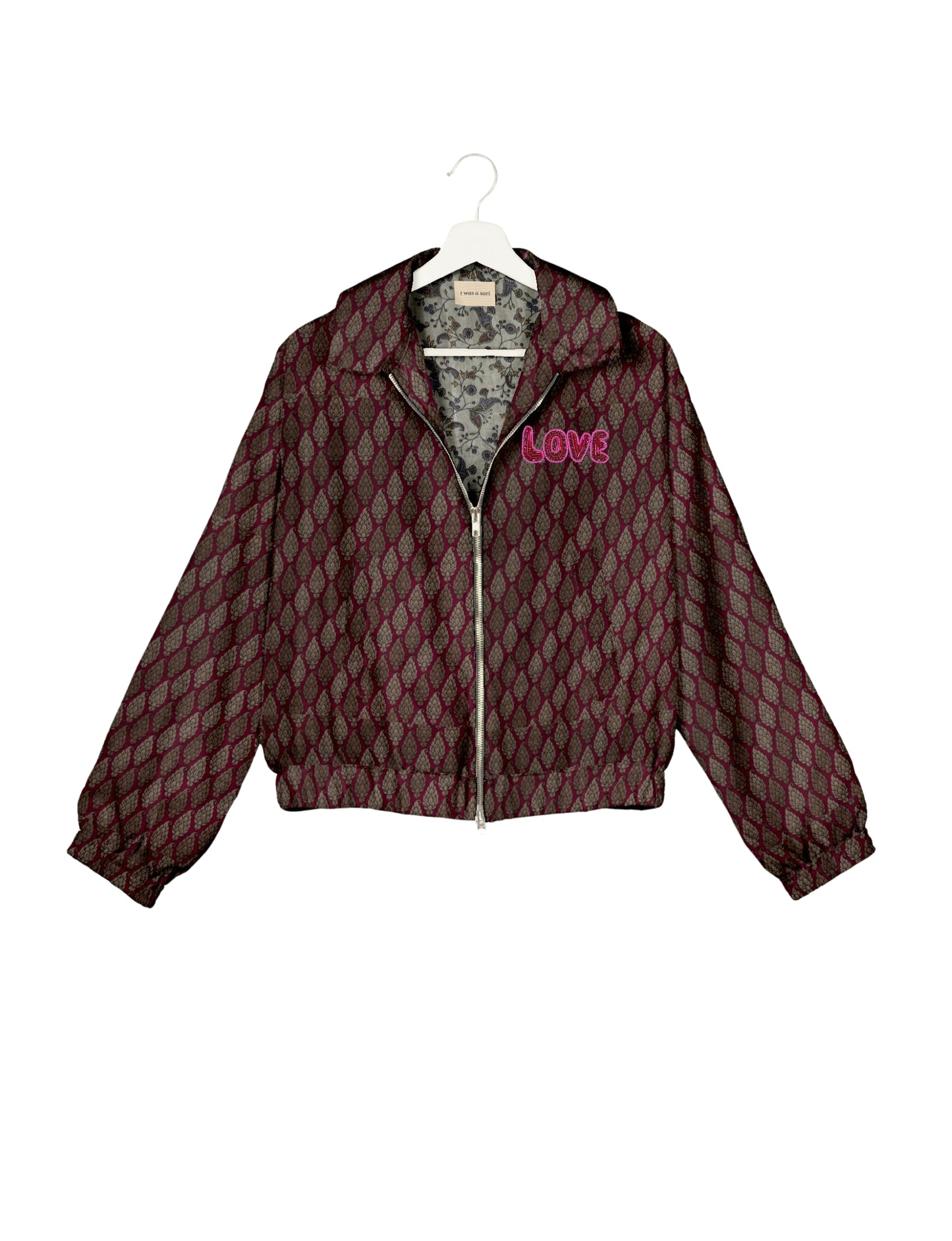 Love Bomber Jacket made from recycled fabric, featuring hand-stitched Aari embroidery. A unique piece of zero-waste clothing, part of the circular fashion movement. Designed with upcycled materials for a stylish yet environmentally friendly clothing choice.