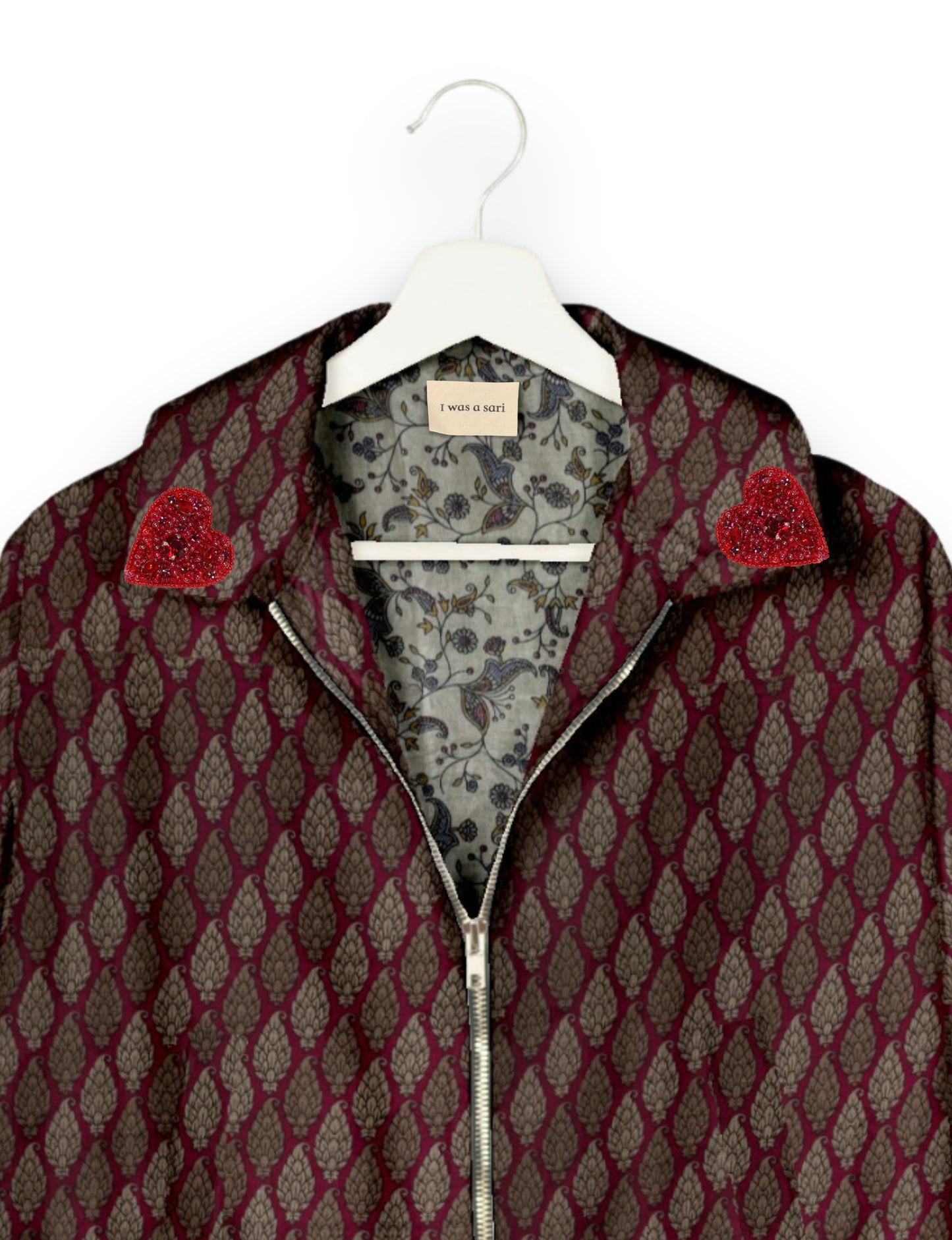 Make a bold statement with our Heart Drop Earrings, a symbol of conscious luxury and ethical fashion. Handcrafted using the intricate Aari embroidery technique, these earrings are made from upcycled sari fabric, embracing slow fashion and zero waste clothing. Elevate your look with sustainable apparel that supports fair trade fashion while reducing textile waste. Choose eco-friendly fashion that speaks of love, artistry, and responsibility.