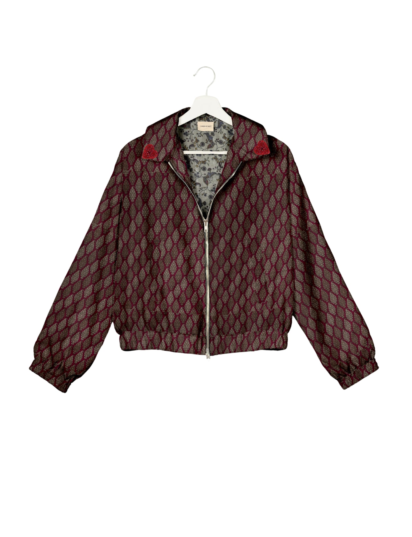 Make a bold statement with our Heart Drop Earrings, a symbol of conscious luxury and ethical fashion. Handcrafted using the intricate Aari embroidery technique, these earrings are made from upcycled sari fabric, embracing slow fashion and zero waste clothing. Elevate your look with sustainable apparel that supports fair trade fashion while reducing textile waste. Choose eco-friendly fashion that speaks of love, artistry, and responsibility.