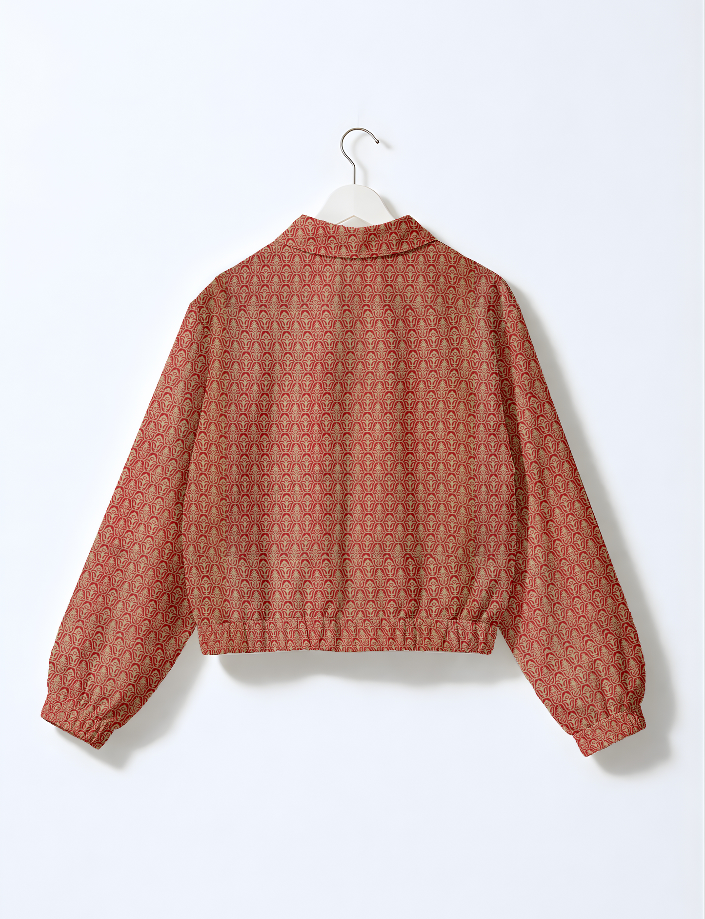 Upcycled Bomber Jacket made from recycled sari materials, featuring a cute cropped shape, elasticated hem and cuffs, and contrast sari print lining. Sustainable apparel promoting eco-friendly fashion and ethical clothing.