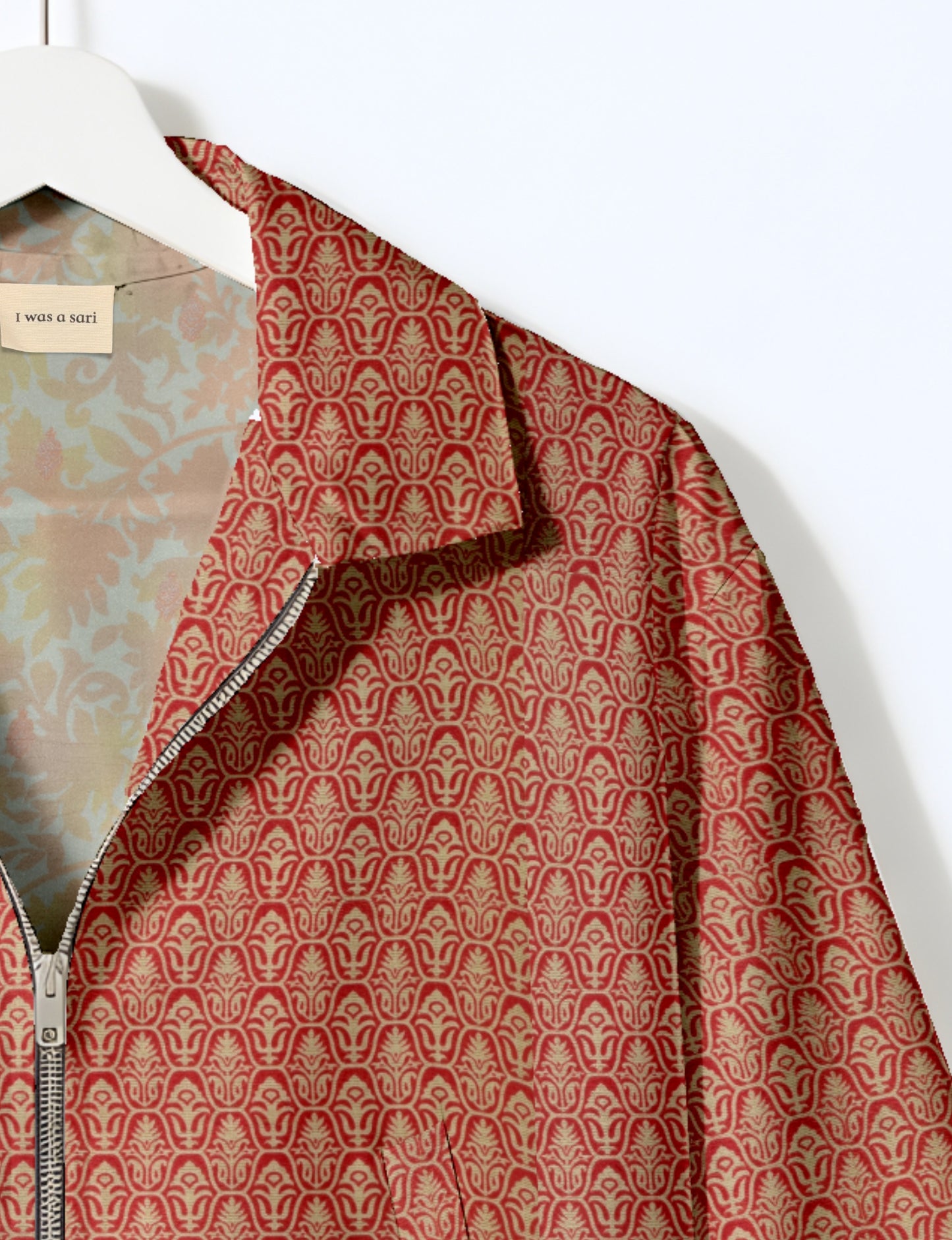 Upcycled Bomber Jacket made from recycled sari materials, featuring a cute cropped shape, elasticated hem and cuffs, and contrast sari print lining. Sustainable apparel promoting eco-friendly fashion and ethical clothing.