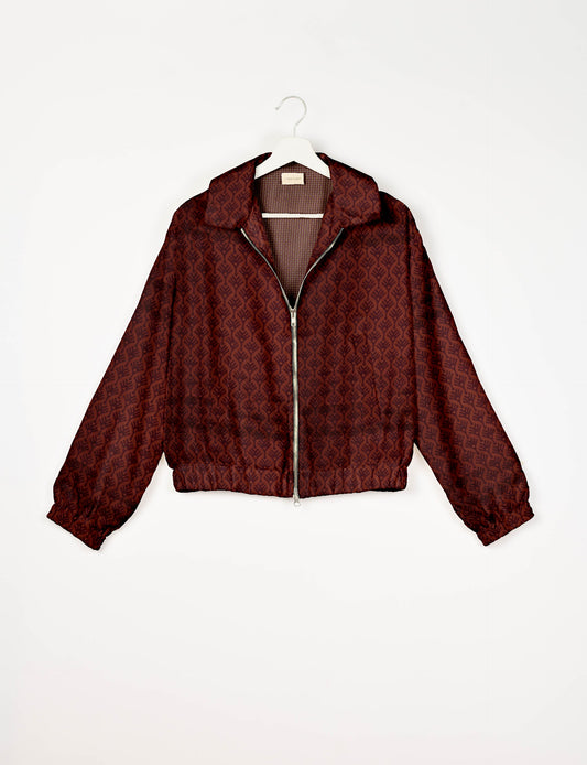 Upcycled Bomber Jacket made from recycled sari materials, featuring a cute cropped shape, elasticated hem and cuffs, and contrast sari print lining. Sustainable apparel promoting eco-friendly fashion and ethical clothing.