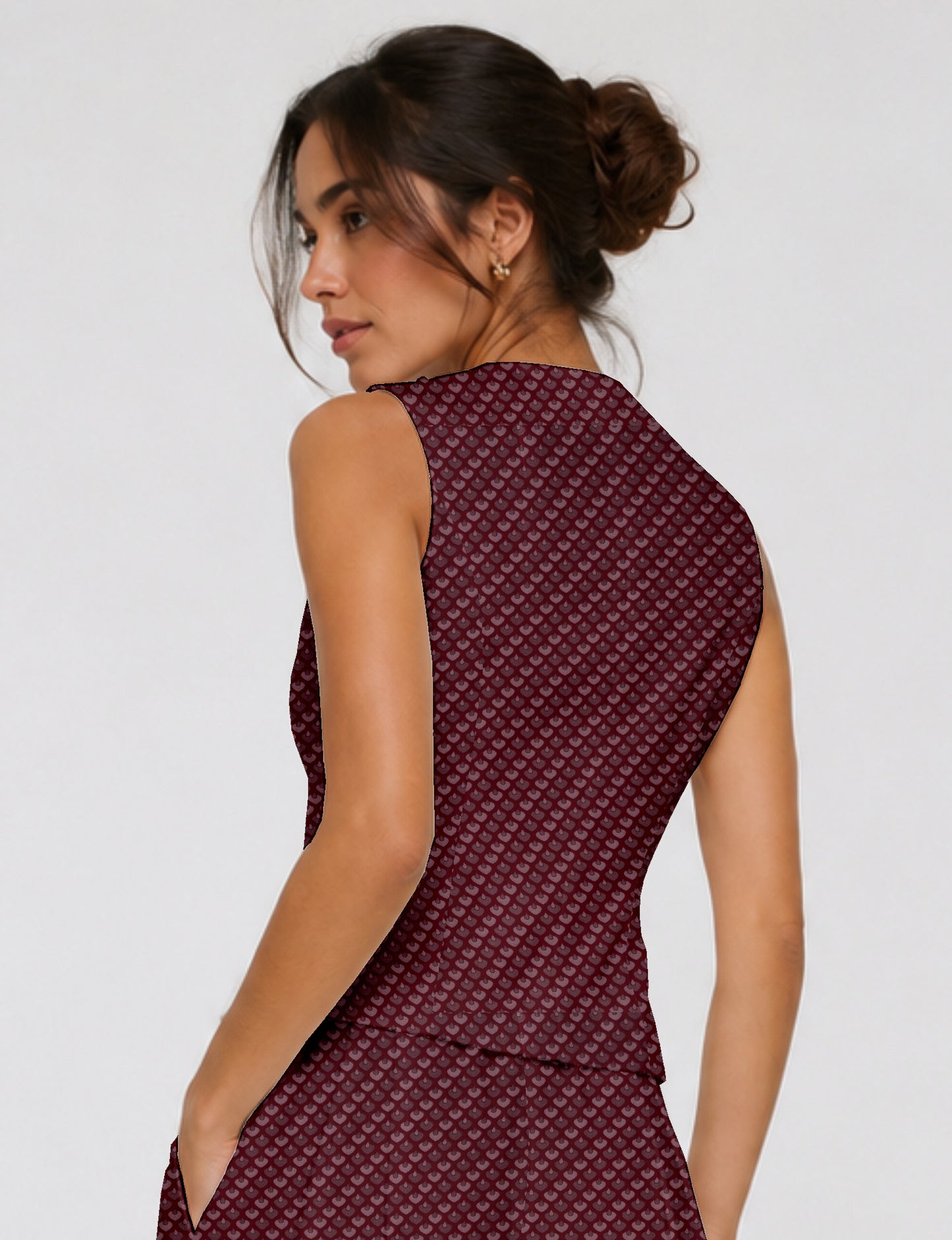 Women's fitted waistcoat with V-neck, single-breasted button closure, tailored silhouette, and pointed hem in sustainable fashion.