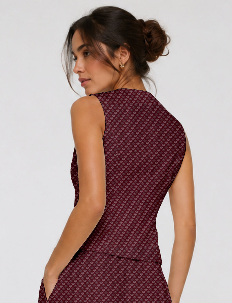 Women's fitted waistcoat with V-neck, single-breasted button closure, tailored silhouette, and pointed hem in sustainable fashion.