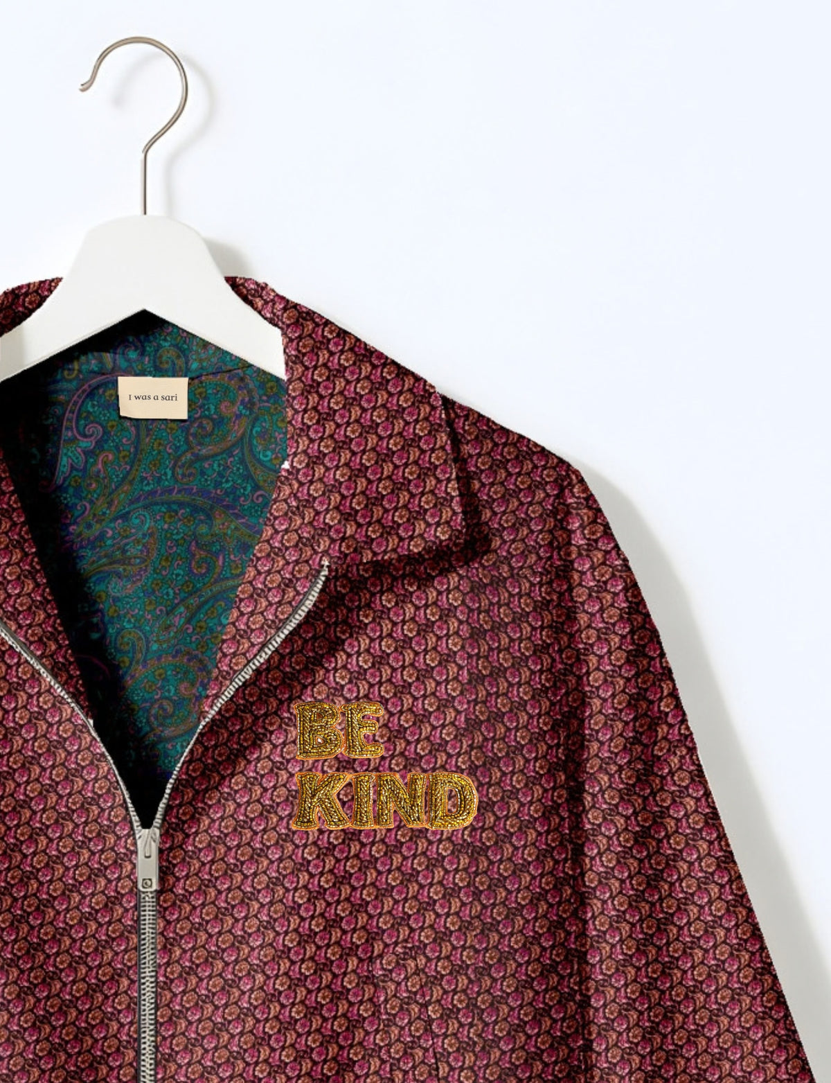 BE KIND Bomber jacket made from upcycled sari fabric with handcrafted Aari embroidery by female artisans.