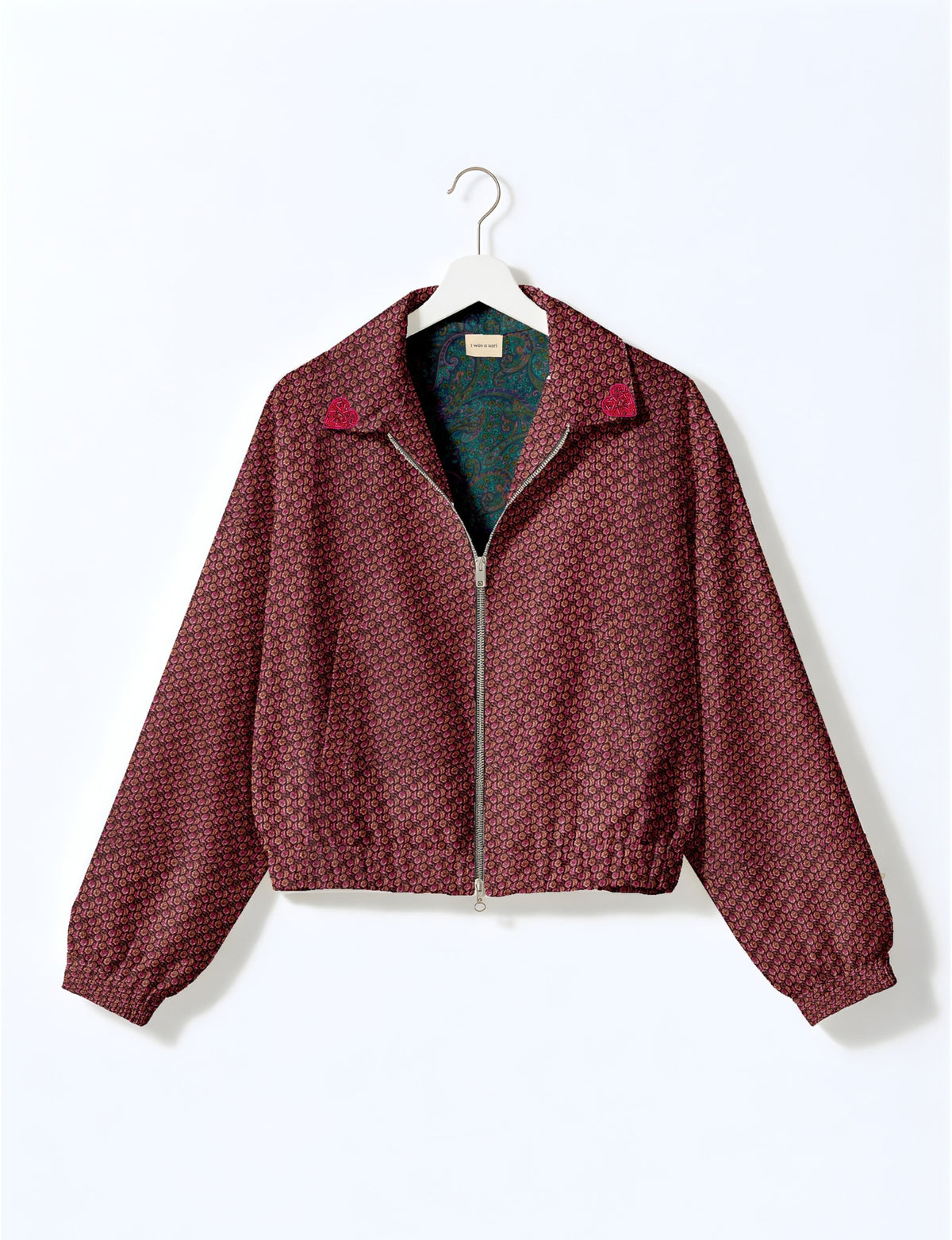 Love Bomber Jacket made from recycled fabric, featuring hand-stitched Aari embroidery. A unique piece of zero-waste clothing, part of the circular fashion movement. Designed with upcycled materials for a stylish yet environmentally friendly clothing choice.