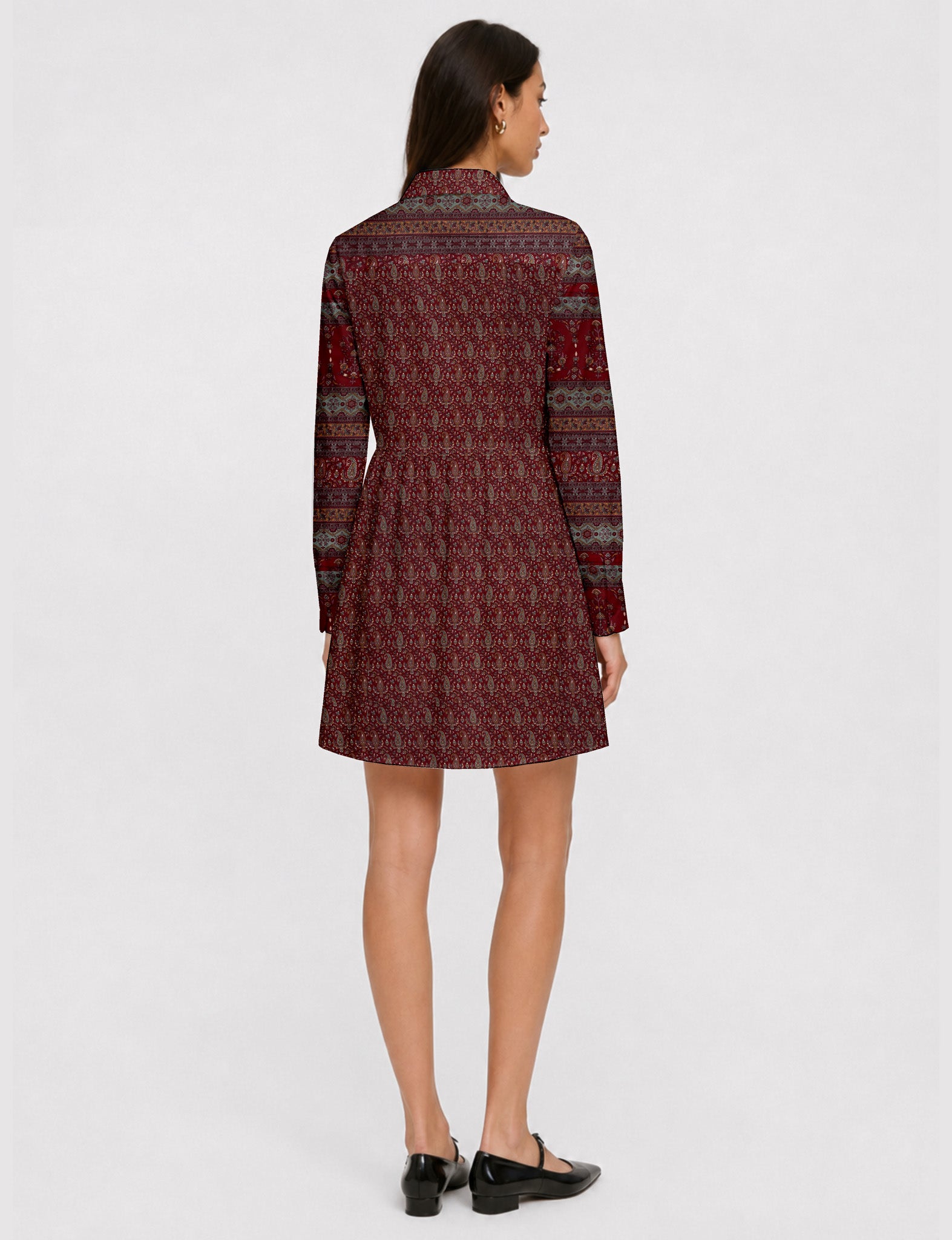 Short shirt dress with a relaxed A-line silhouette, point collar, partial button placket, gathered waist, side pockets, and full-length cuffed sleeves.