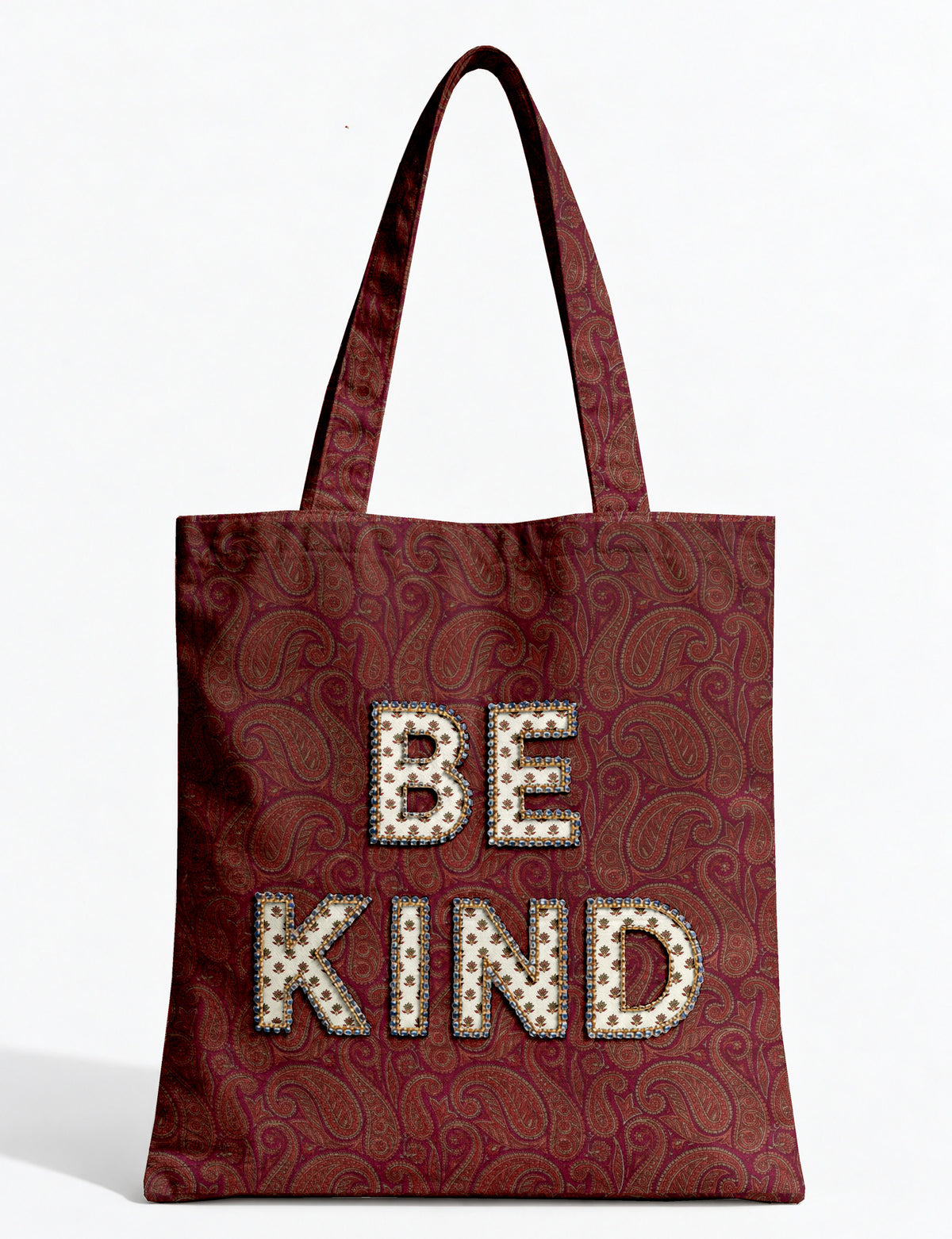 Be Kind tote bag with contrast sari fabric appliqué lettering, double shoulder straps, and front slip pocket.