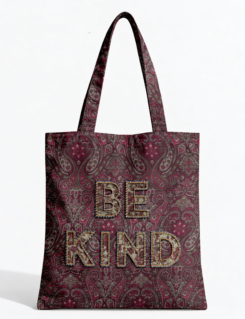 Be Kind tote bag with contrast sari fabric appliqué lettering, double shoulder straps, and front slip pocket.