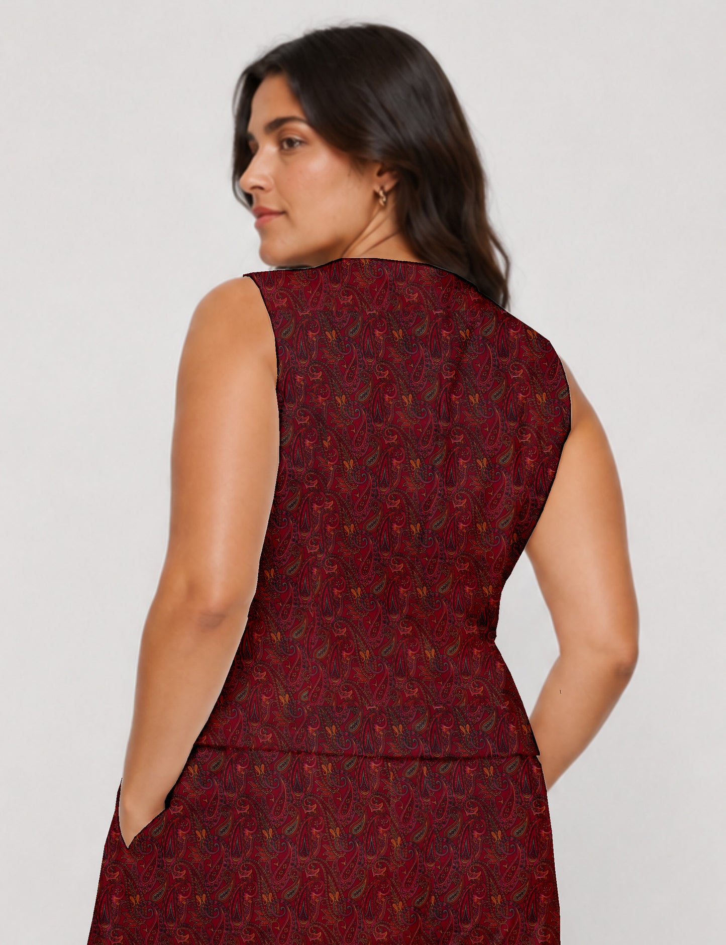 Women's fitted waistcoat with V-neck, single-breasted button closure, tailored silhouette, and pointed hem in sustainable fashion.